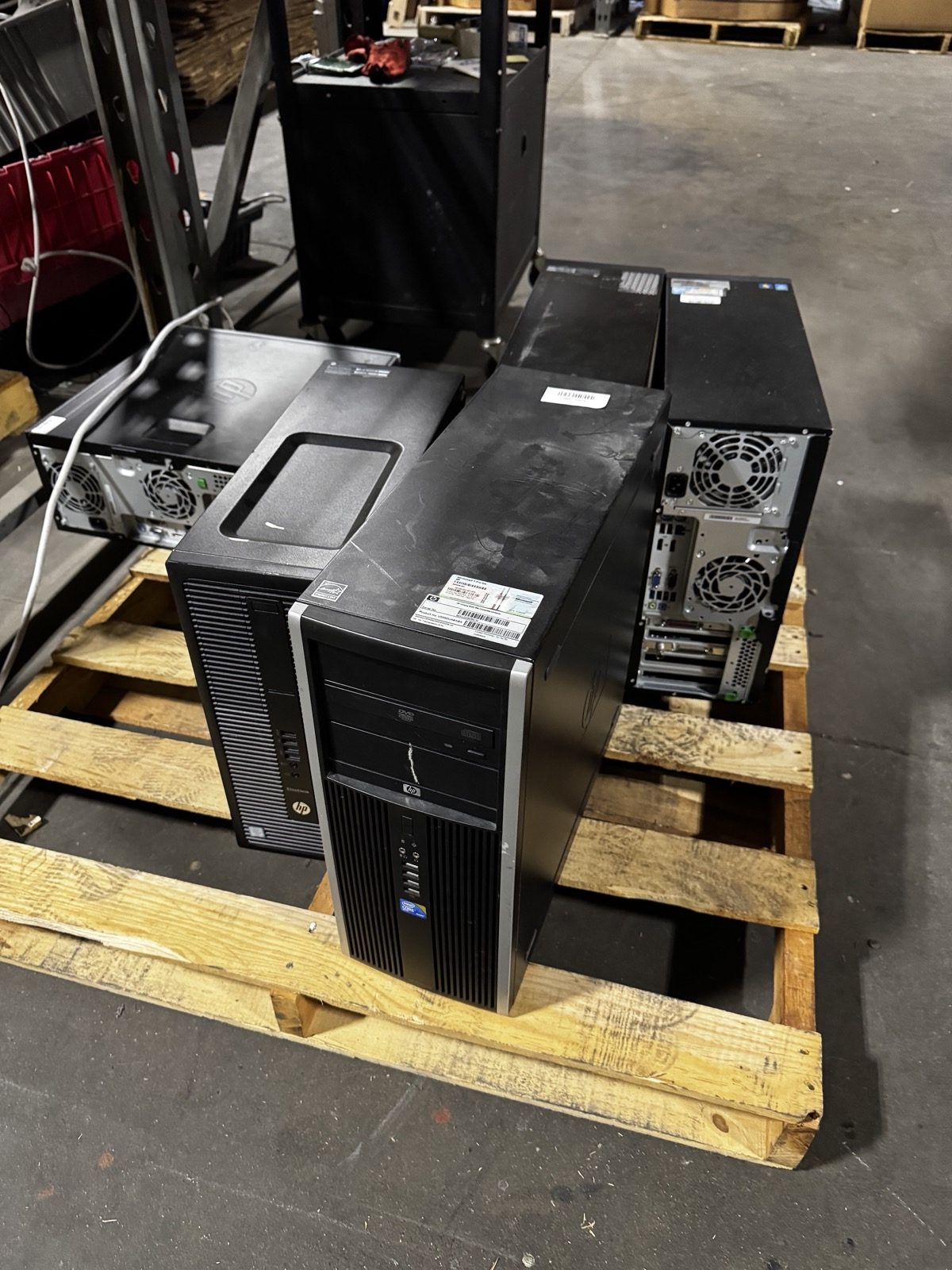 Stacked business desktop computers ready for e-waste pickup